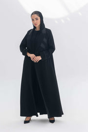Noira Belle black crepe abaya with striped satin panels and modern design details