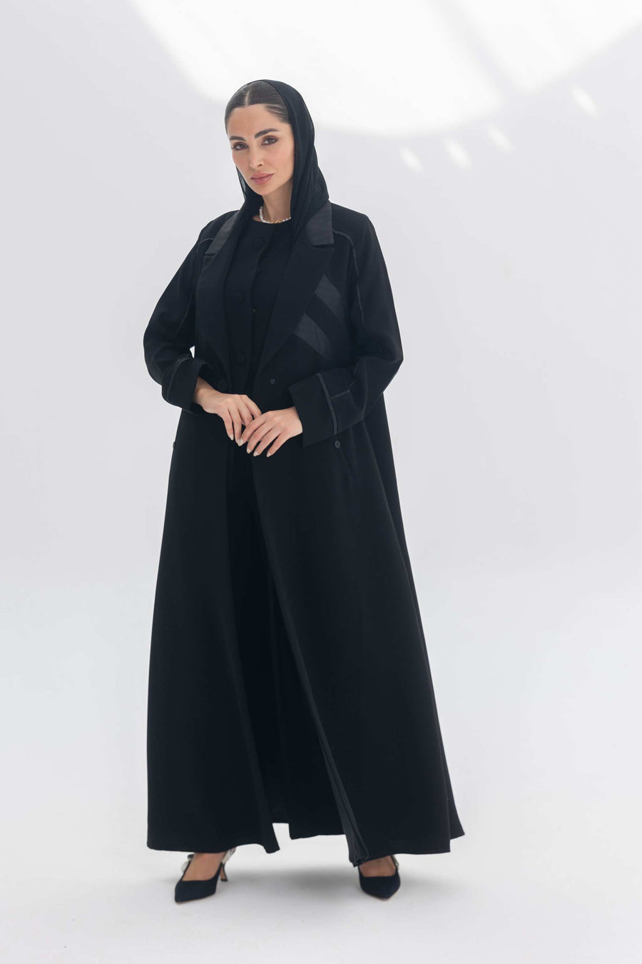 Noira Belle black crepe abaya with striped satin panels and modern design details