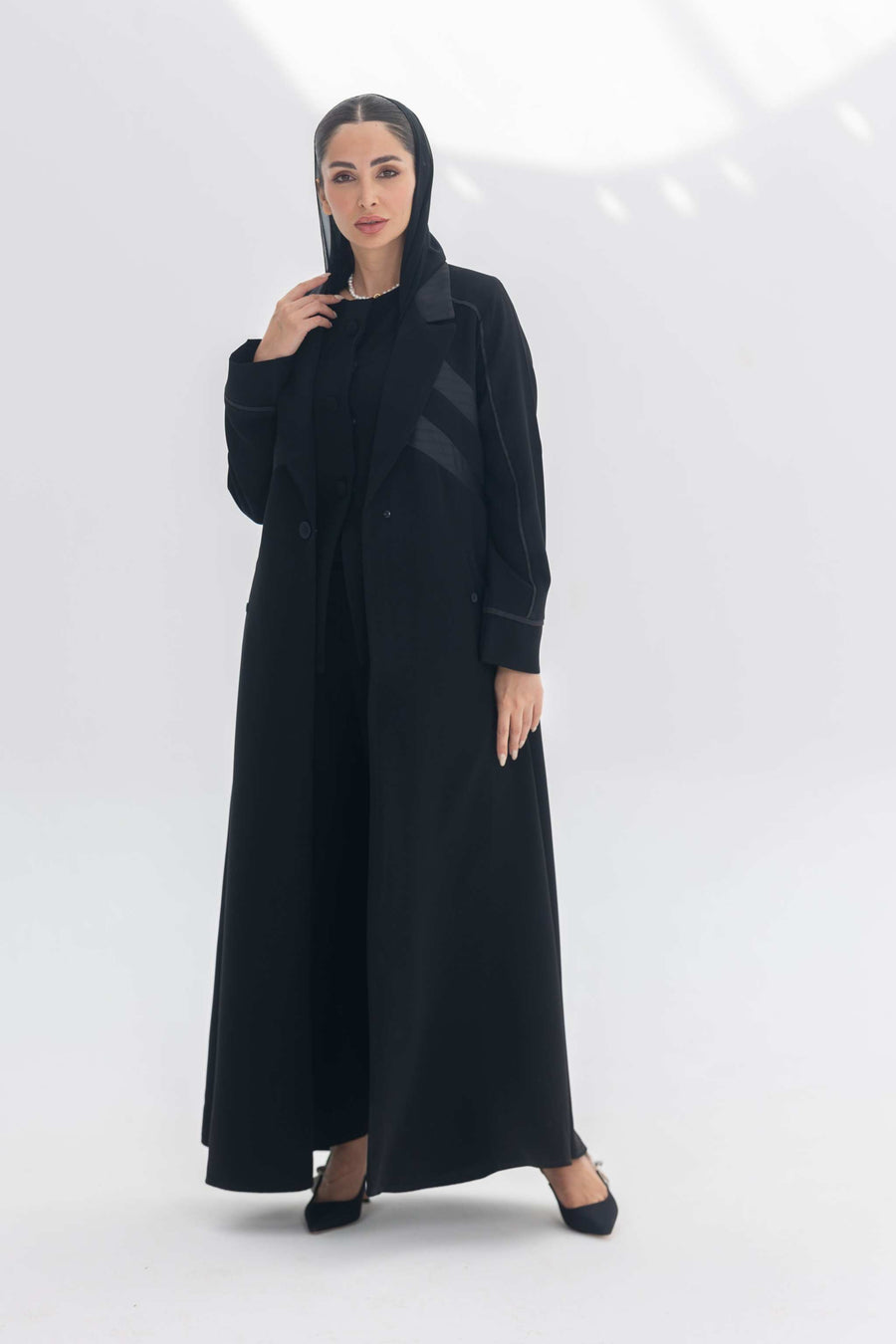 Noira Belle black crepe abaya with striped satin panels and modern elegant design