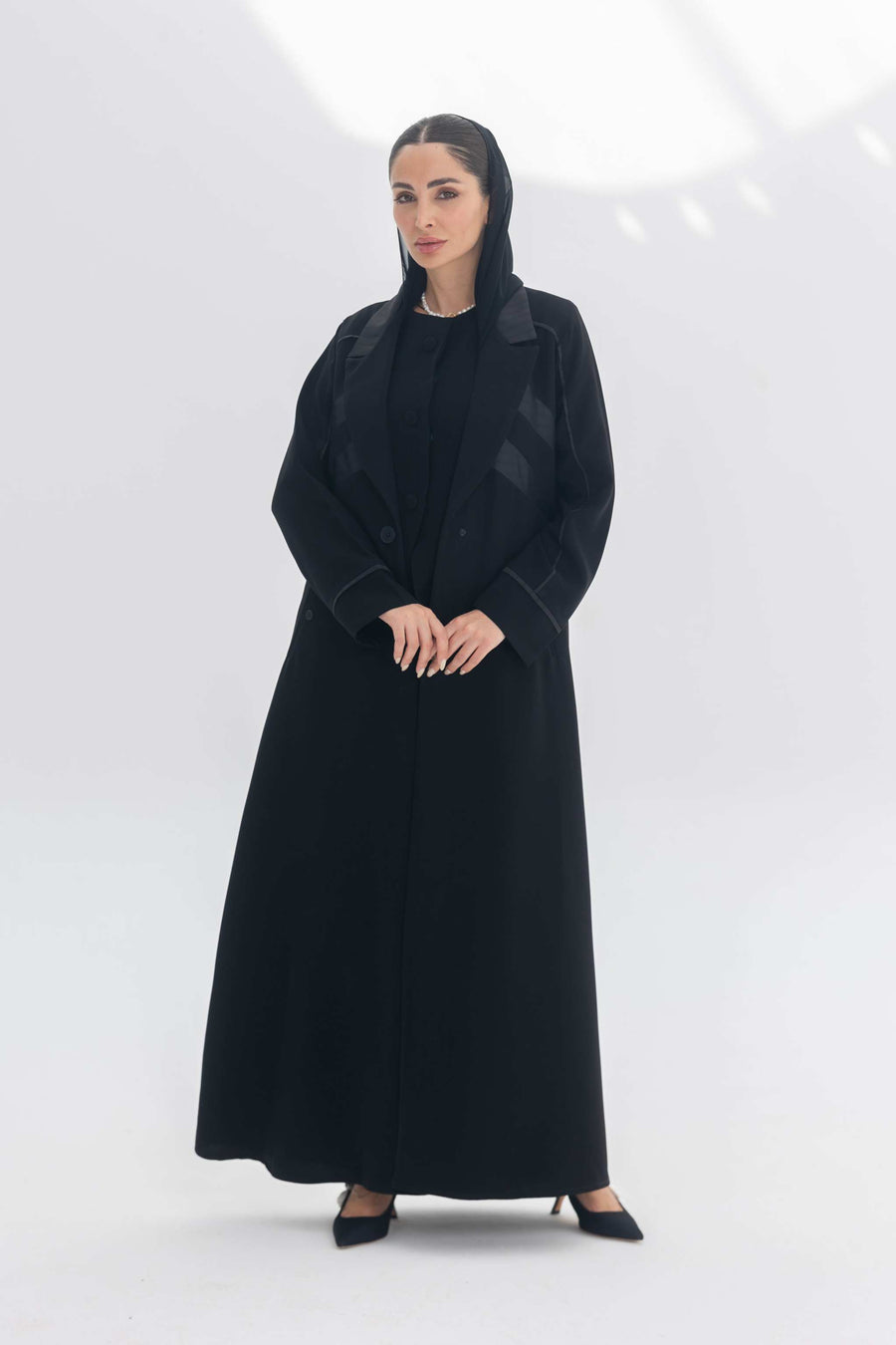 Noira Belle black crepe abaya with striped satin panels and modern elegant design