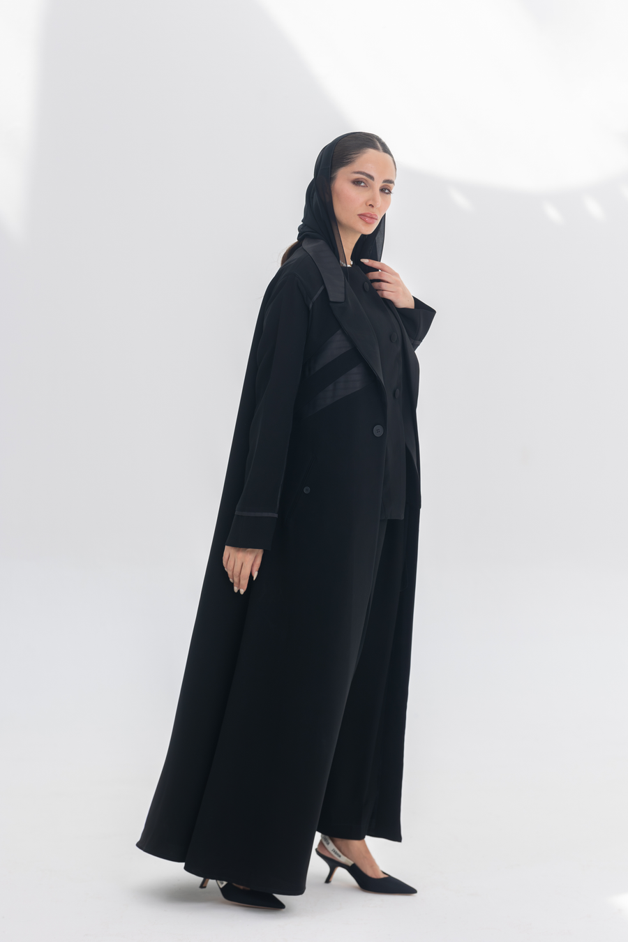 Noira Belle black crepe abaya with striped satin panels, modern elegant design for women