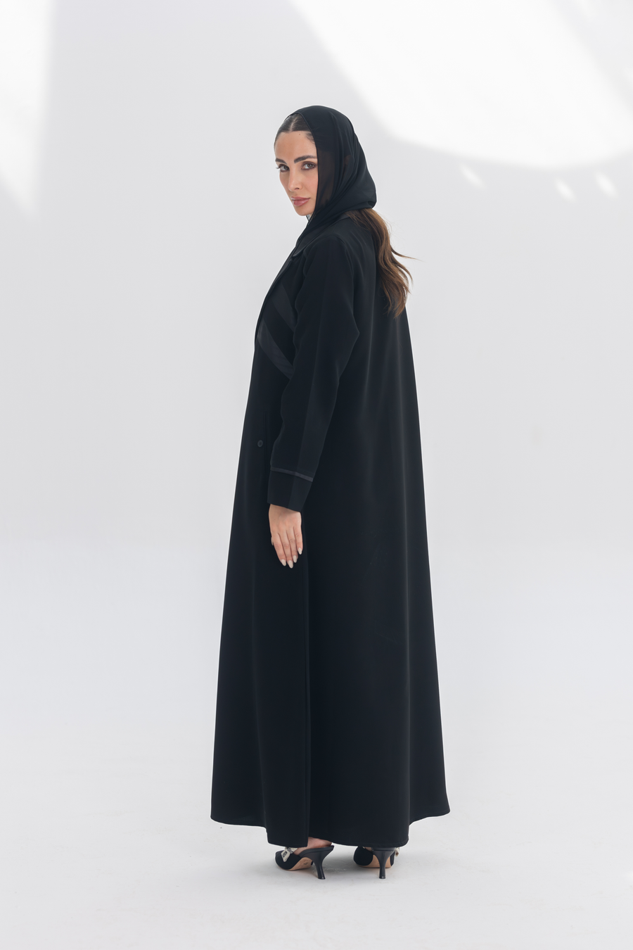 Noira Belle black crepe abaya with striped satin panels and modern elegant design