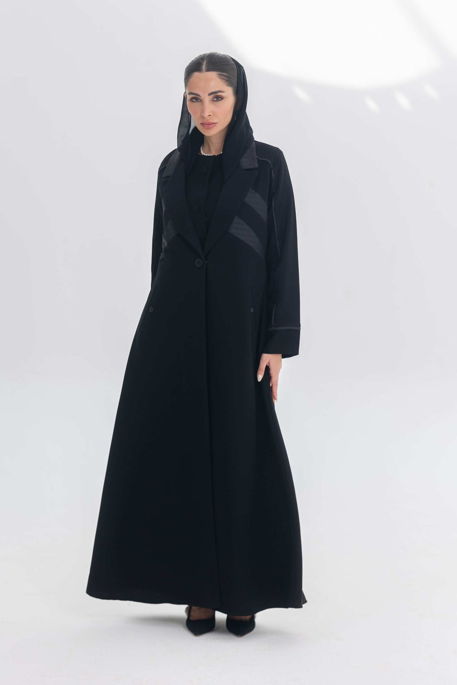 Black crepe Noira Belle abaya with striped satin panels and modern elegant design
