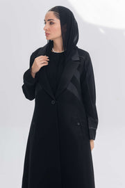 Noira Belle black crepe abaya with striped satin panels and modern elegant design