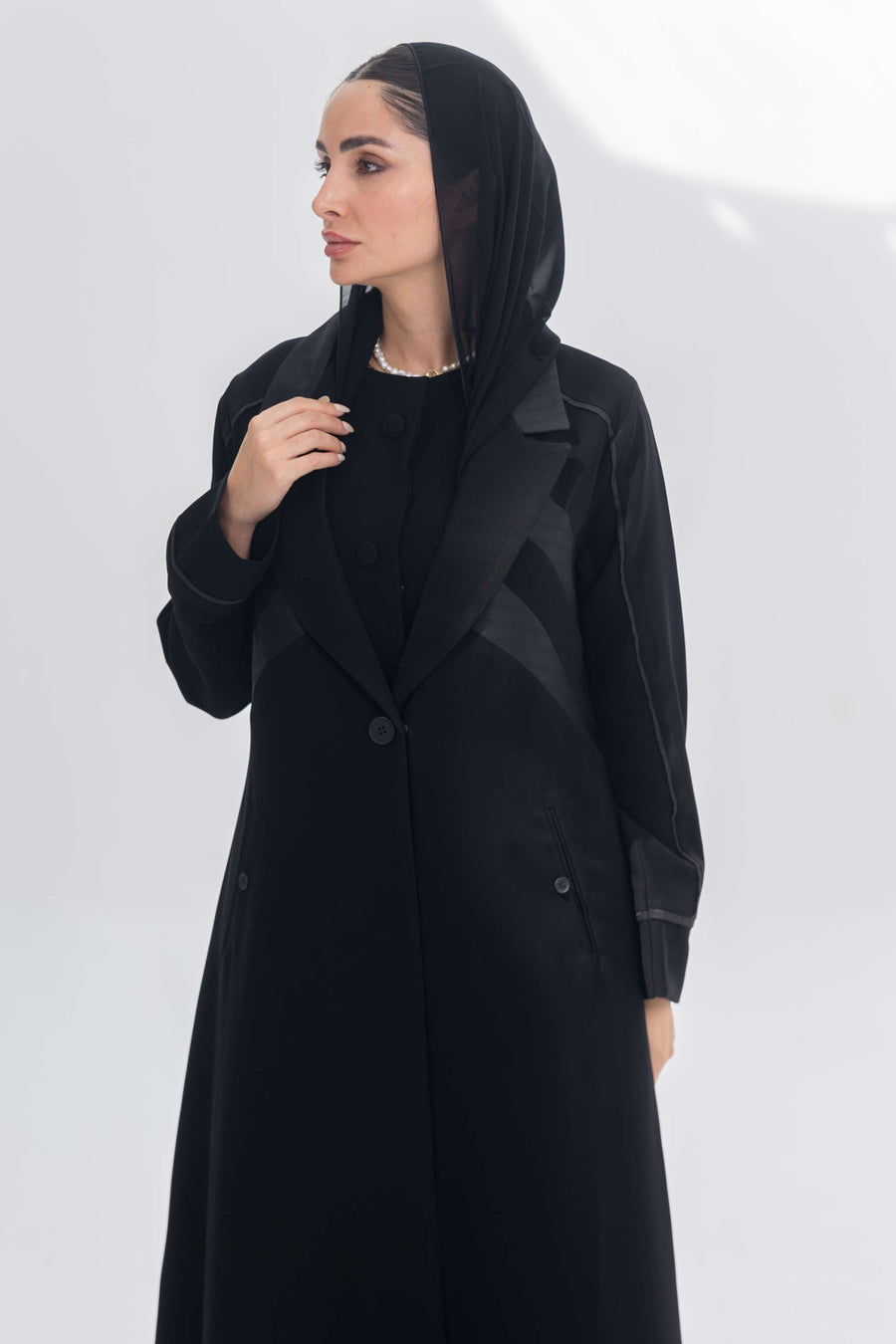 Noira Belle black crepe abaya with striped satin panels and modern elegant design