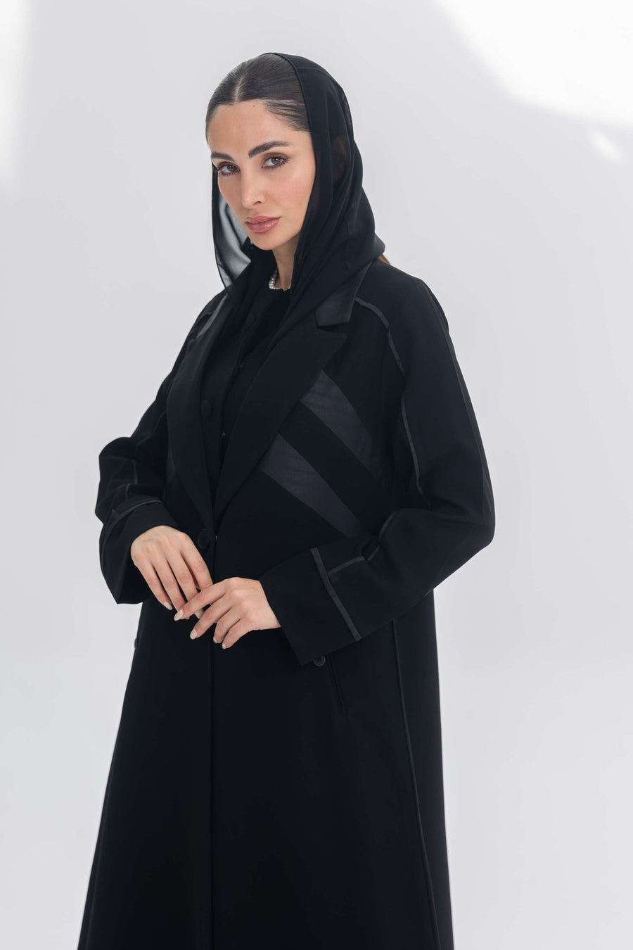 Noira Belle black crepe abaya with striped satin panels and modern elegant design