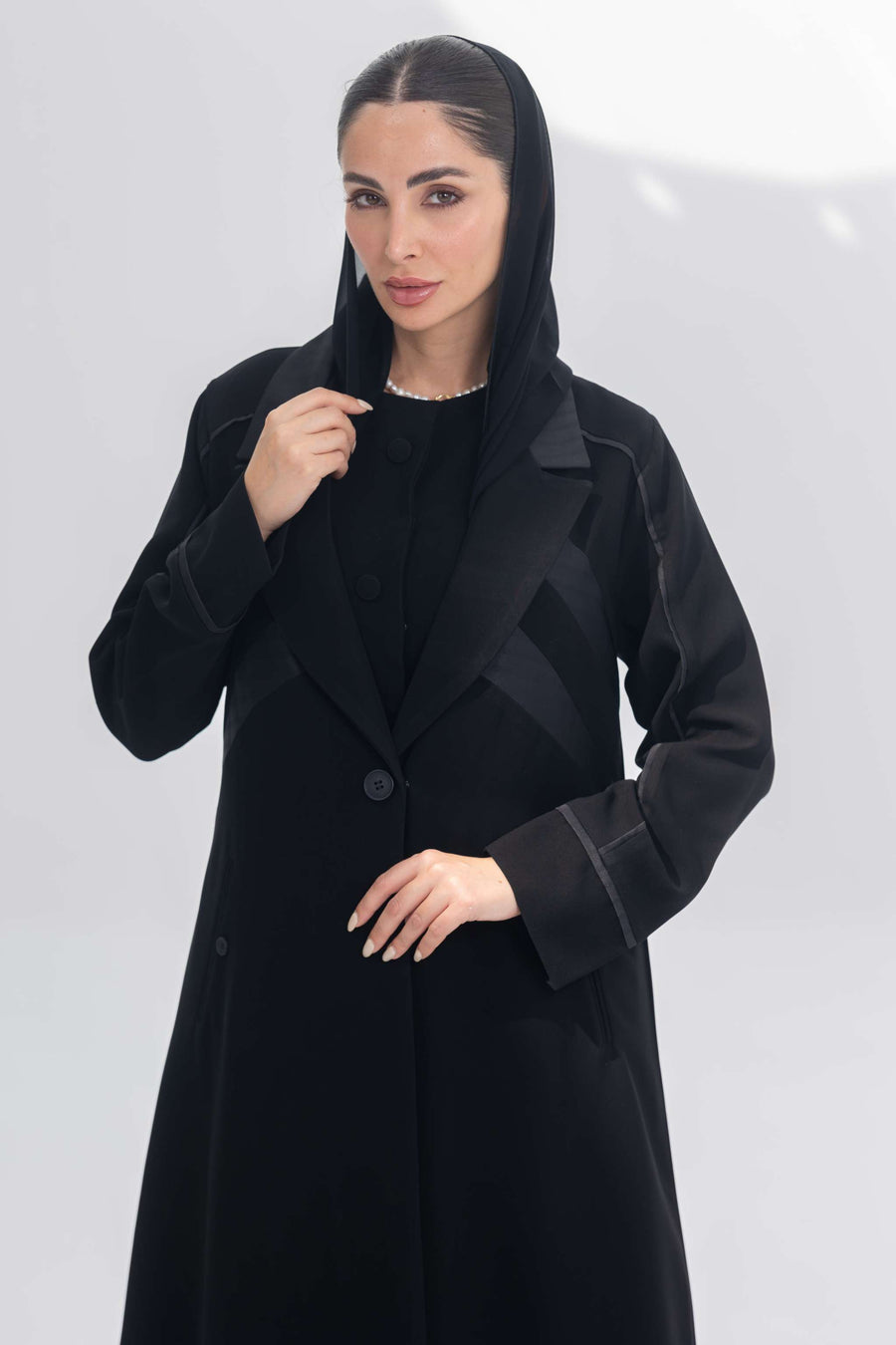 Noira Belle black crepe abaya with striped satin panels and modern elegant design