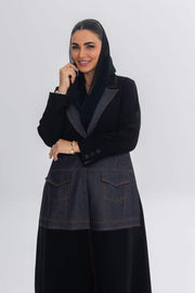 Woman wearing Blue Stitch black crepe and denim fusion abaya with modern chic design