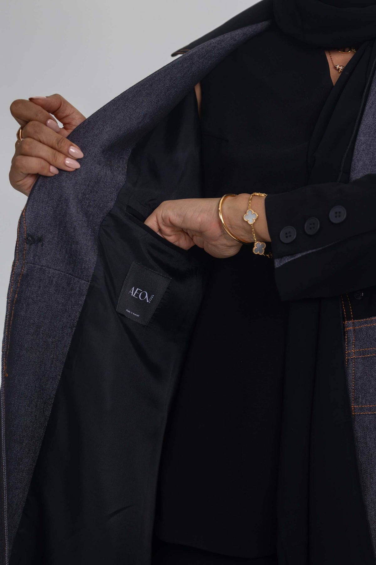 Blue Stitch abaya featuring black crepe and denim fabric fusion for modern elegance