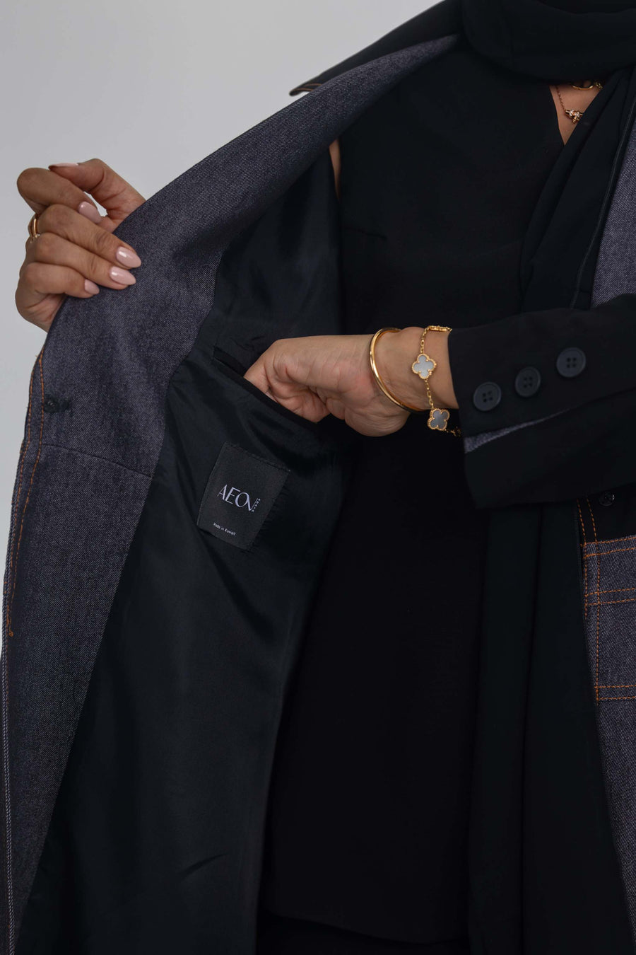 Blue Stitch abaya featuring black crepe and denim fabric fusion for modern elegance