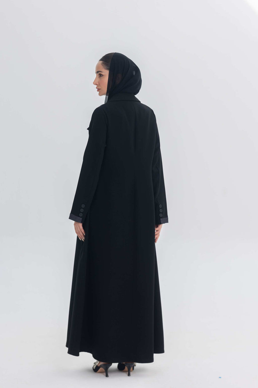 Black crepe abaya with denim accents worn by woman in headscarf, modern modest fashion Denim Veil
