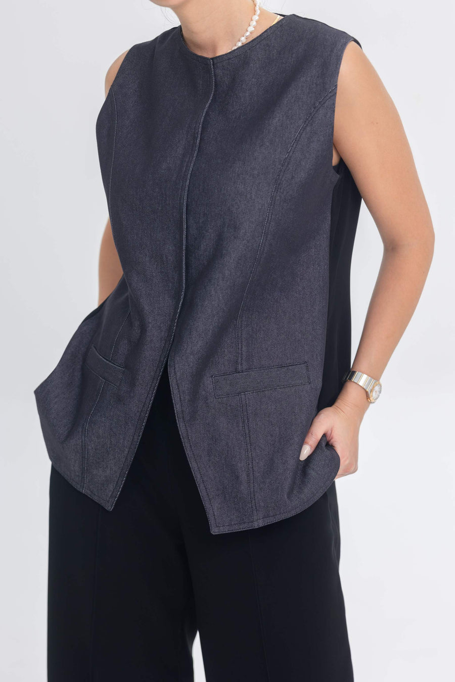 Woman wearing True Bleu denim sleeveless top and black crepe pants outfit