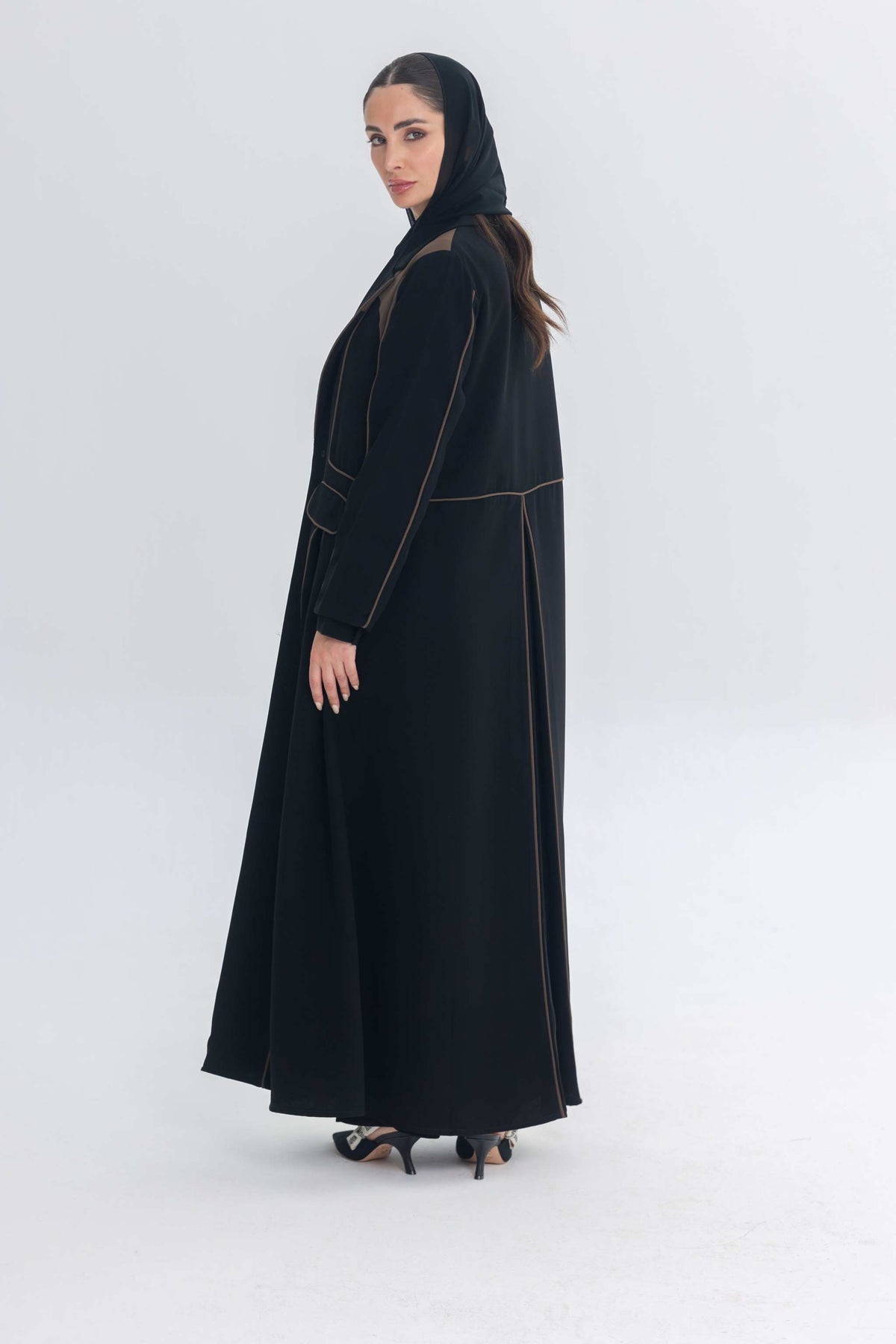 Black abaya with rich brown 3D detailing called Cocoa Shadow, combining traditional and contemporary styles.