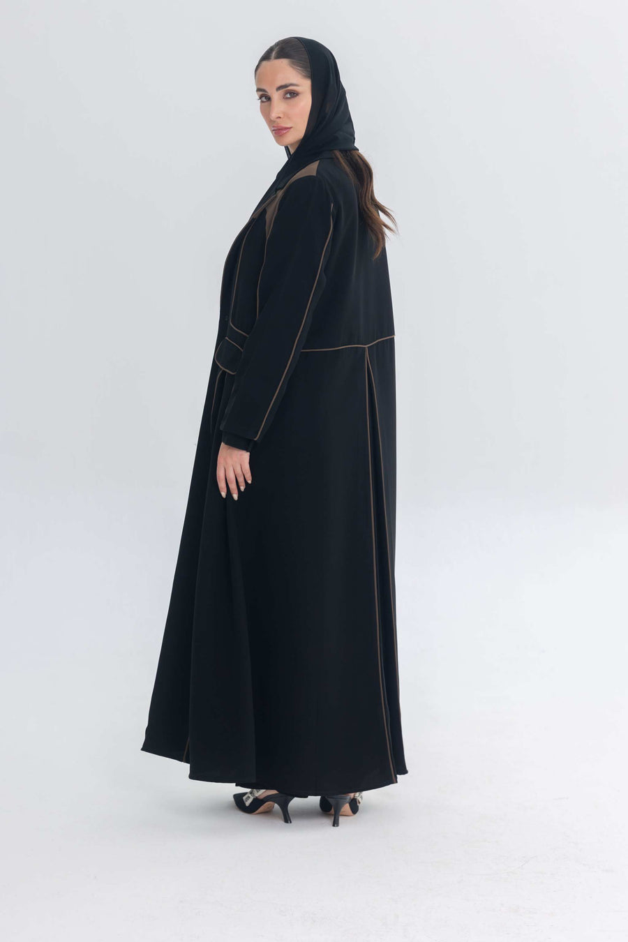 Black abaya with rich brown 3D detailing called Cocoa Shadow, combining traditional and contemporary styles.
