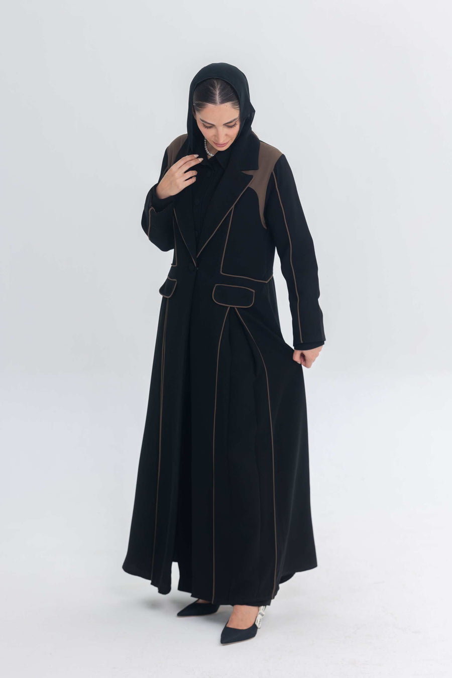 Black abaya with rich brown Cocoa Shadow detailing and 3D effect showcasing elegant, contemporary design.