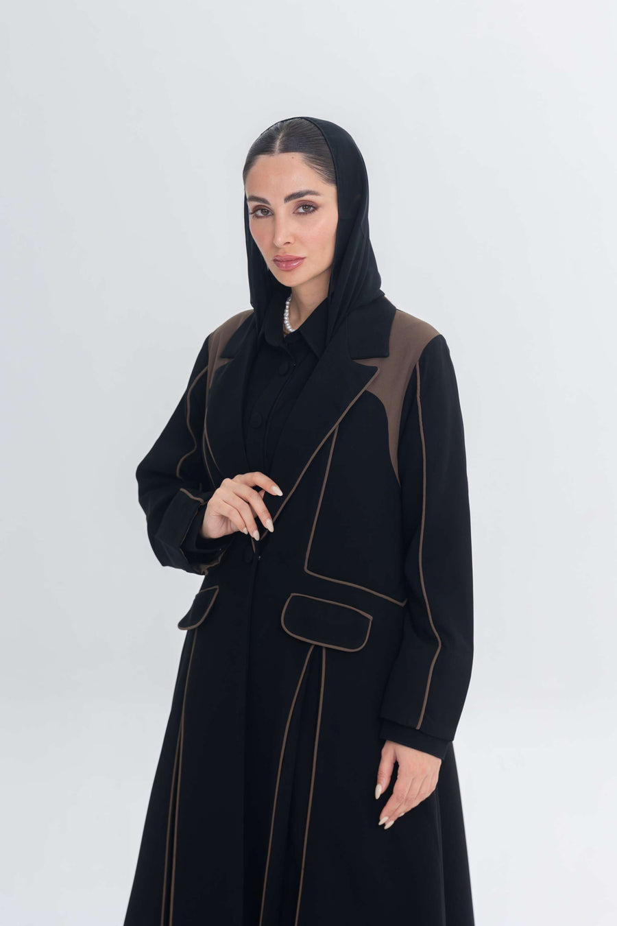 Black abaya with rich brown 3D detailing and Cocoa Shadow design, blending tradition and contemporary style.