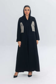 Elegant black crepe abaya with textured jacquard panels for a modern, sophisticated look