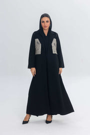 Elegant black crepe abaya with jacquard panel detailing and flowing silhouette