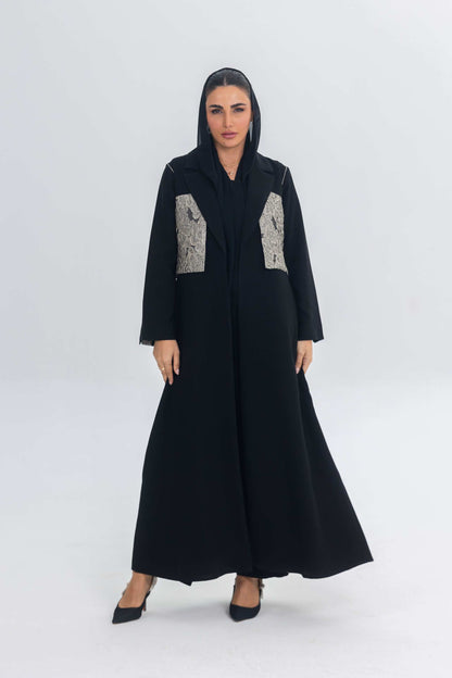 Elegant black crepe abaya with jacquard panel detailing and flowing silhouette