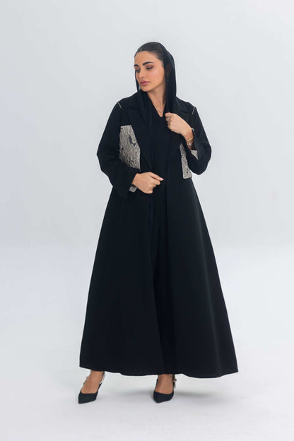 Elegant black crepe abaya with textured jacquard panel and flowing design for modern women