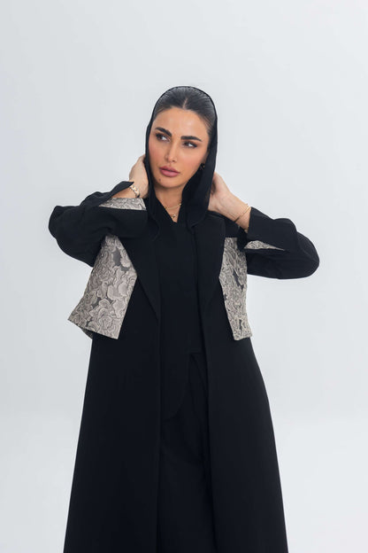 woman wearing elegant black crepe abaya with jacquard panel detailing