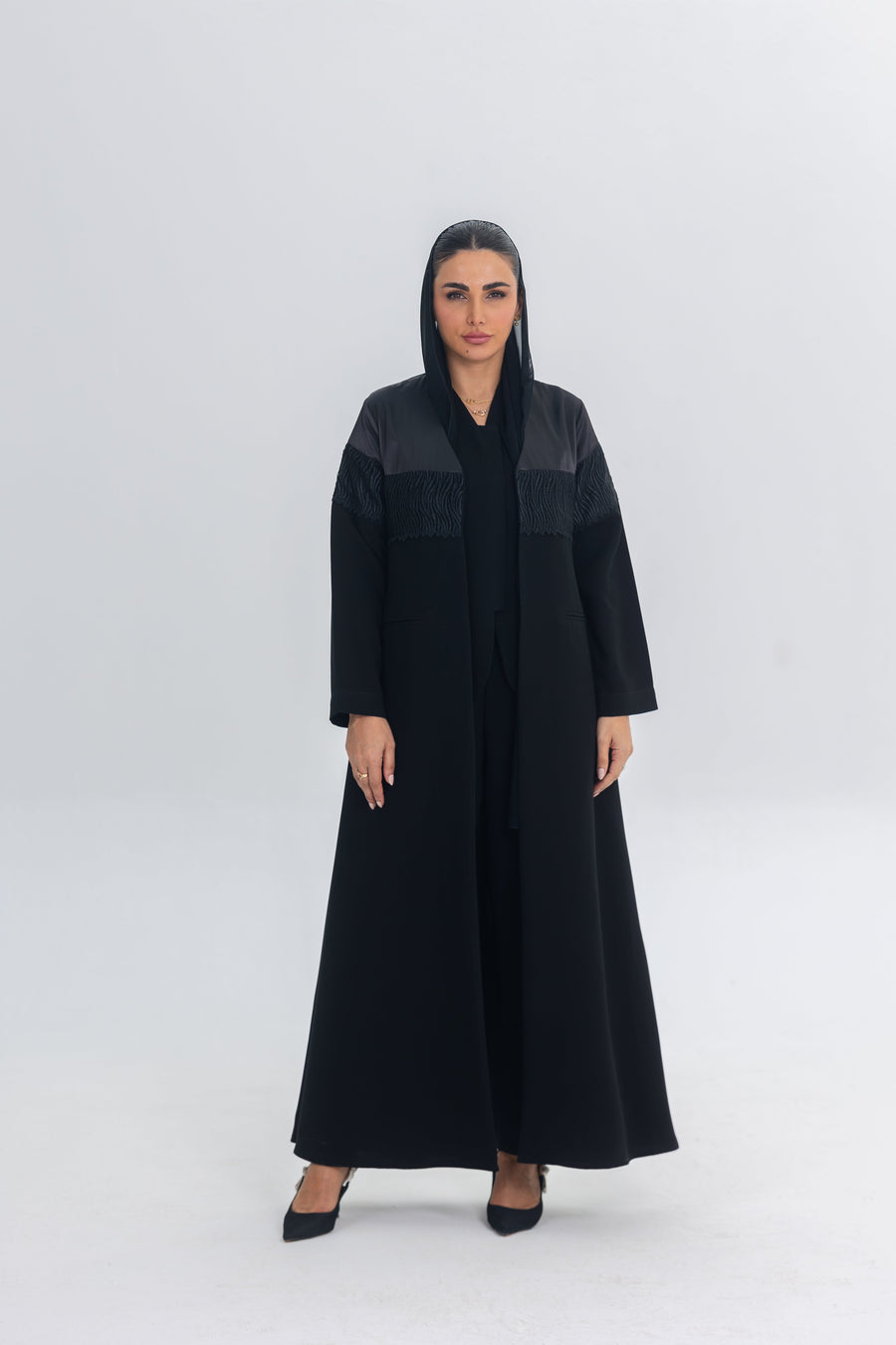 Black Satin Eclipse abaya with crepe and lace details, elegant and flowing design for regal occasions
