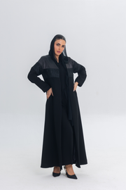 Elegant black Satin Eclipse abaya featuring luxurious satin, flowing crepe, and intricate lace detailing, styled for a regal and sophisticated look.