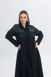 Black satin and crepe abaya with lace detailing and a regal elegant design.