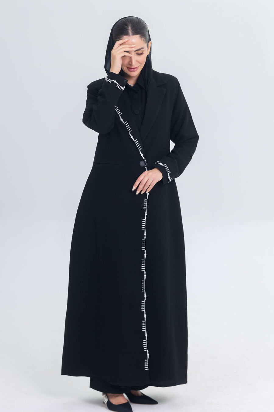 Elegant black crepe blazer abaya with white pearl and bead embroidery detailing on front and cuffs