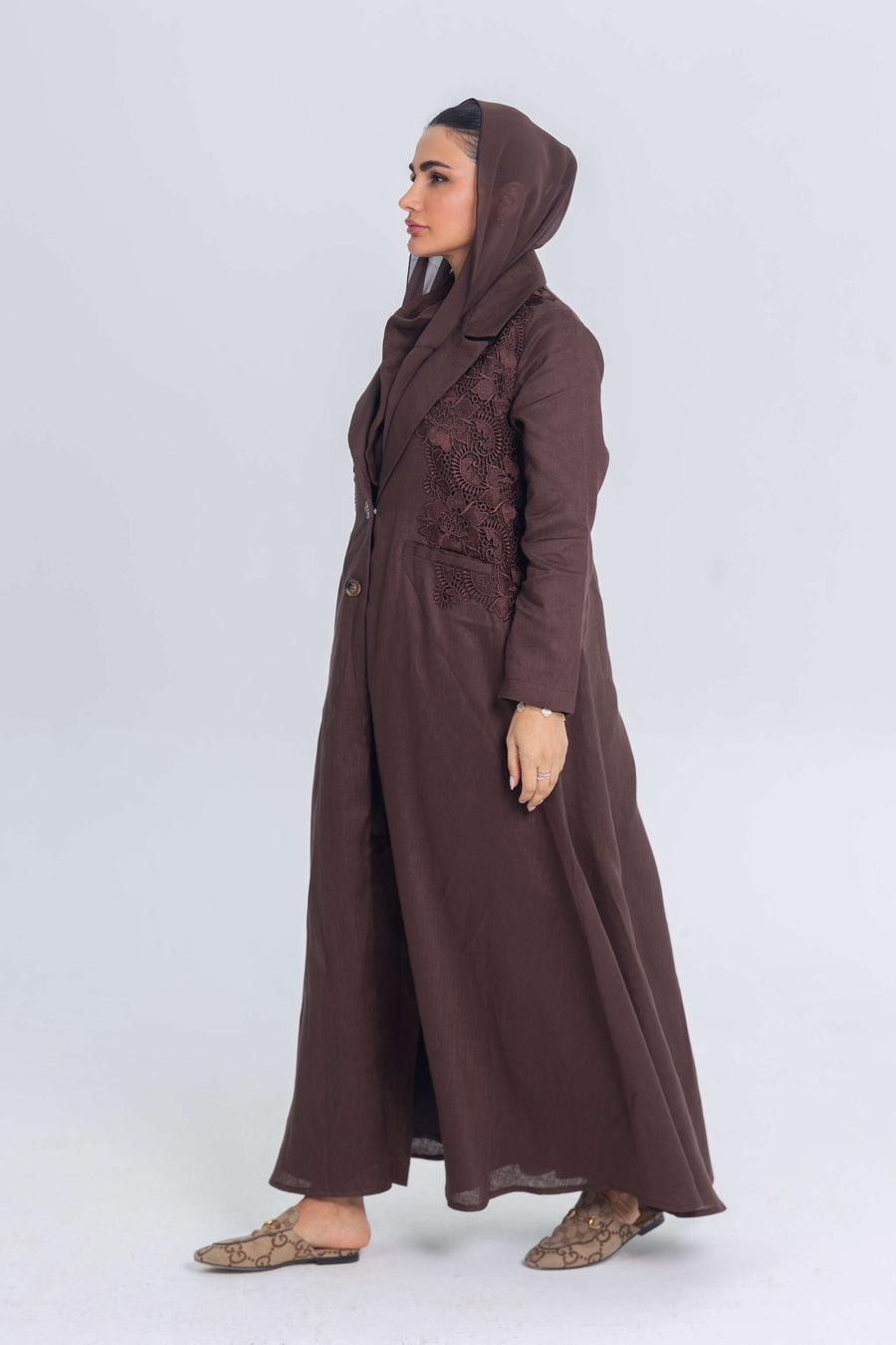 Brown linen abaya with blazer collar and floral lace embroidery patches, lightweight summer wear.