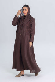 Woman wearing brown linen abaya with blazer collar and floral lace embroidery patches