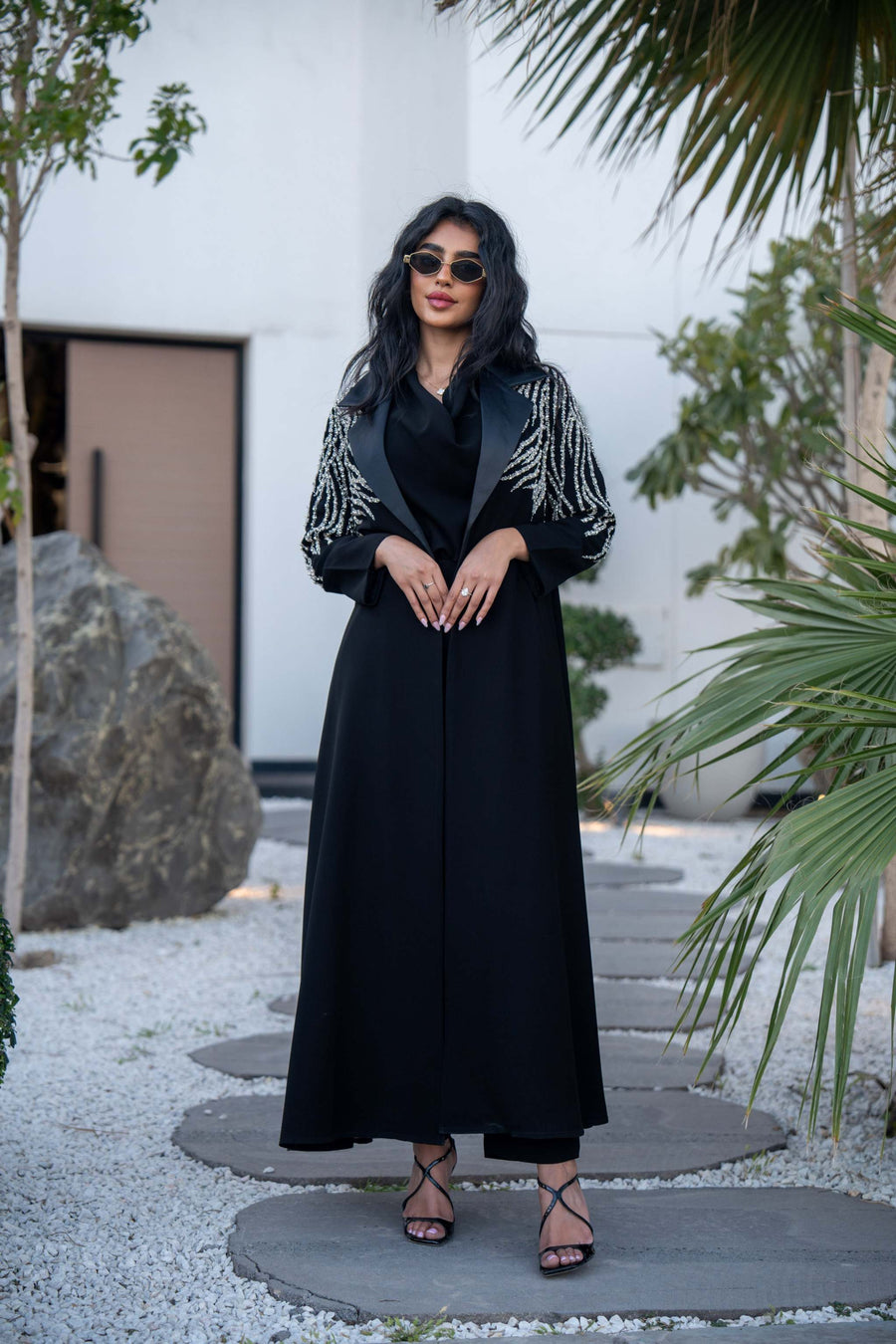 Elegant black Ella abaya with intricate handmade embroidery on sleeves, combining crepe and mokado fabrics for a structured silhouette.