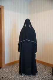 Elegant black abaya with white embroidery and matching embroidered sheila veil