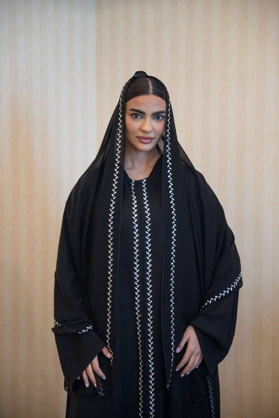 Black Echo abaya with white embroidery, straight cut, front buttons, and matching embroidered sheila.