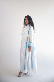 White linen blazer abaya with blue triangular embroidery and chiffon inner layer, featuring pleats and classic lapel design.