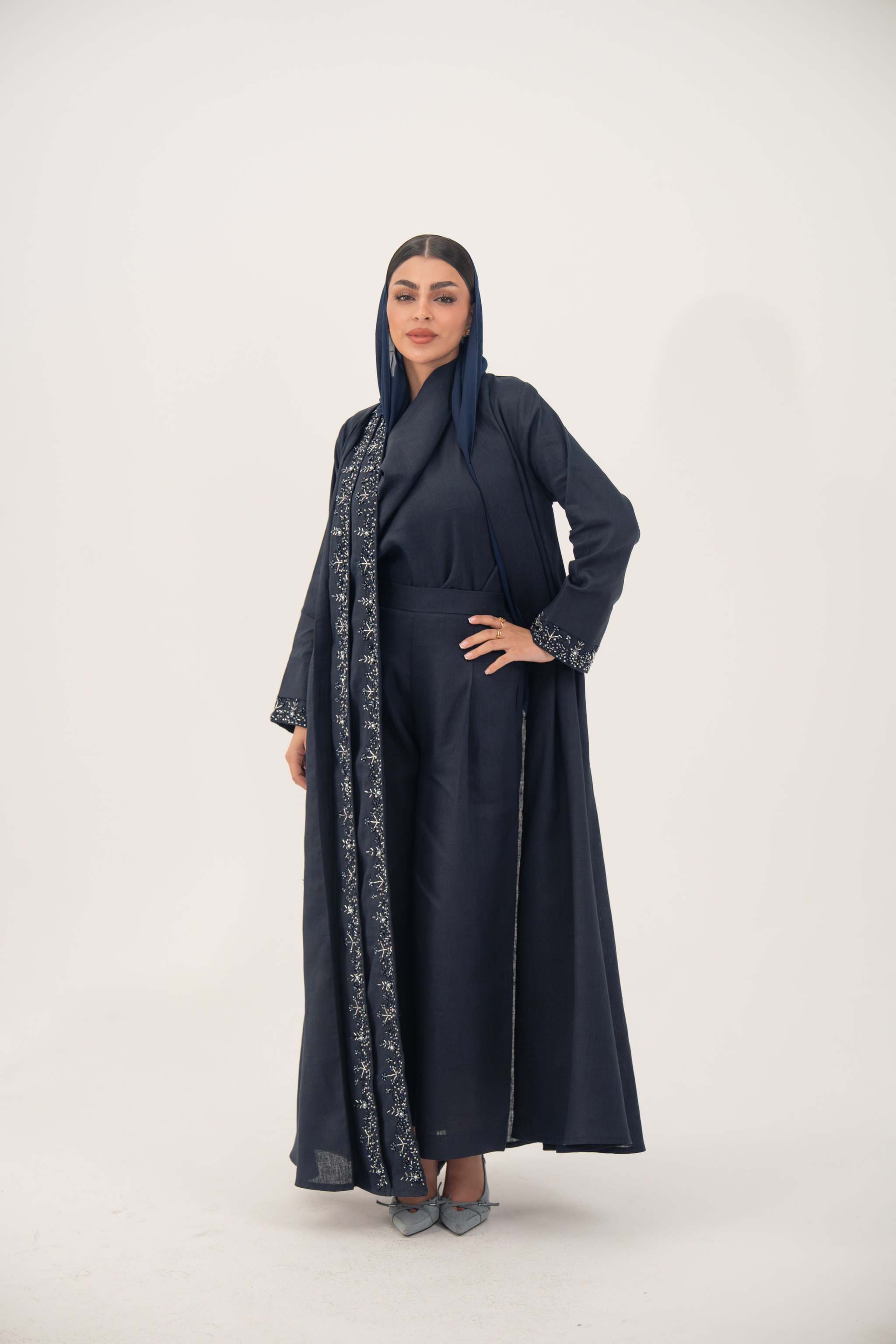High-quality linen abaya with delicate shak beading on front panels and cuffs, open-front flowy design with structured shoulders