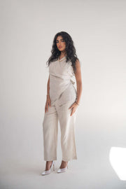 Sleeveless Almond Beige Blouse with front wrap design and soft pleats for elegant drape