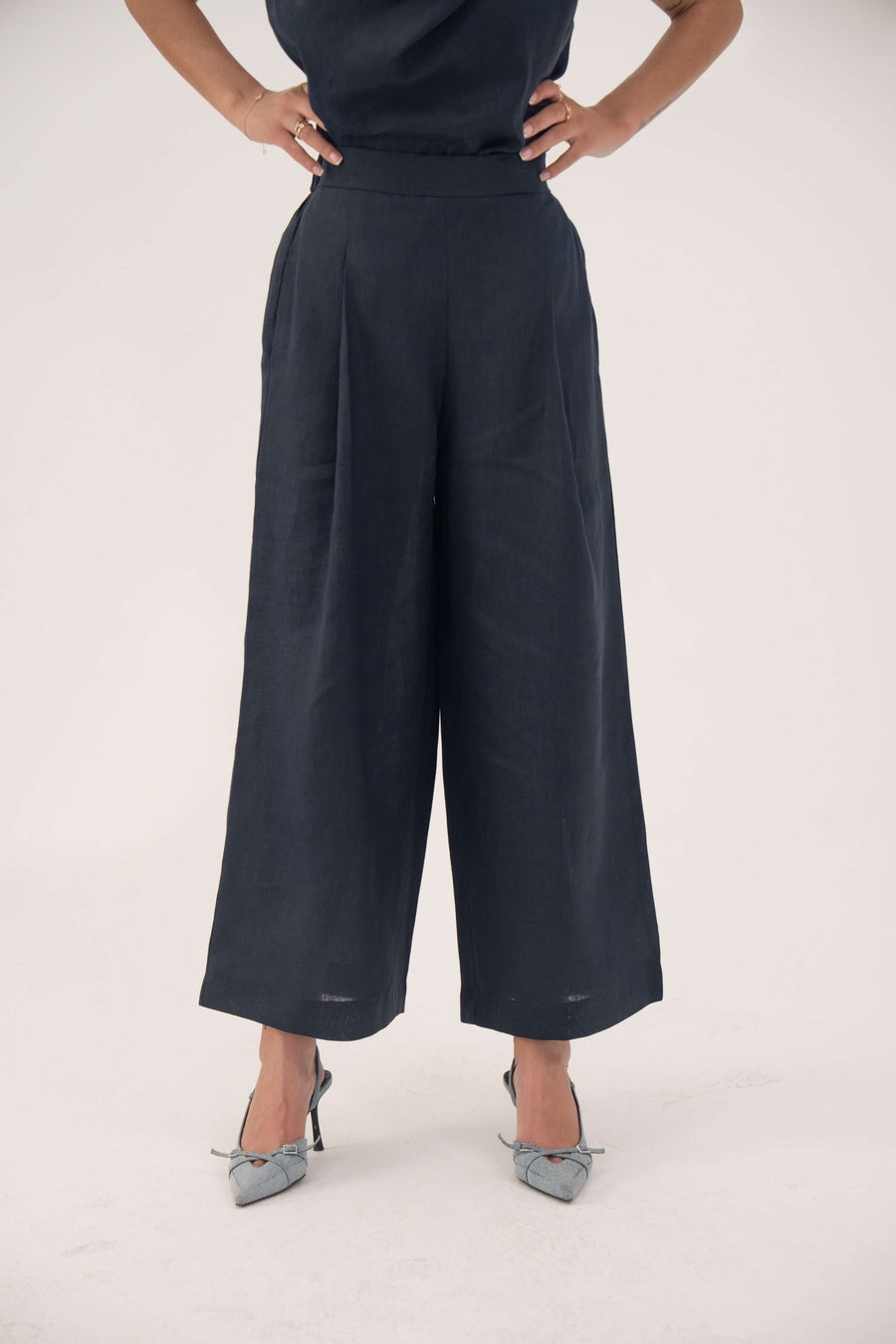 Indigo Wide Leg linen pants with high waist, soft front pleats, hidden side pockets, and wide legs for a comfortable, stylish look.
