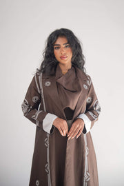 Brown linen blazer abaya with white geometric and circular embroidery, classic lapel, and chiffon lining.