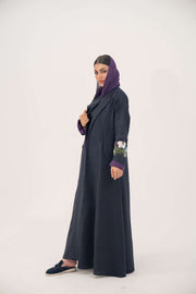 Blackberry navy blue linen-blend abaya with purple cuffs and hand-stitched floral embroidery