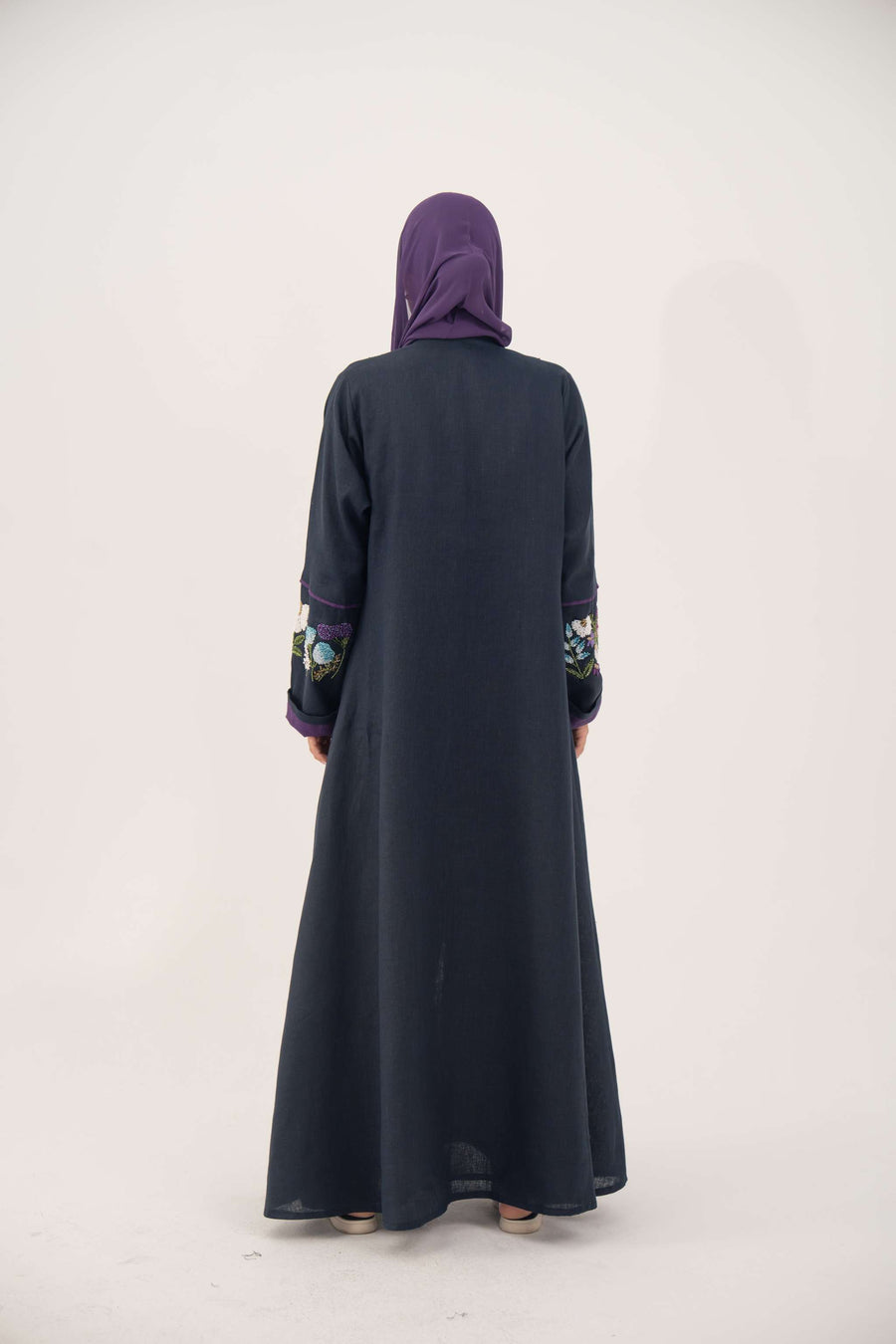 Blackberry navy blue linen-blend abaya with purple cuffs and hand-stitched floral embroidery