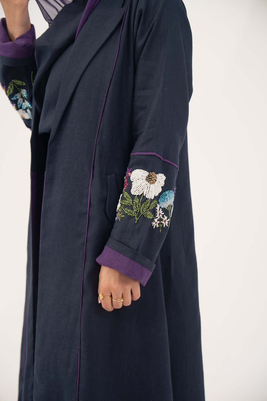 Blackberry navy blue linen-blend abaya with purple cuffs and hand-stitched floral embroidery