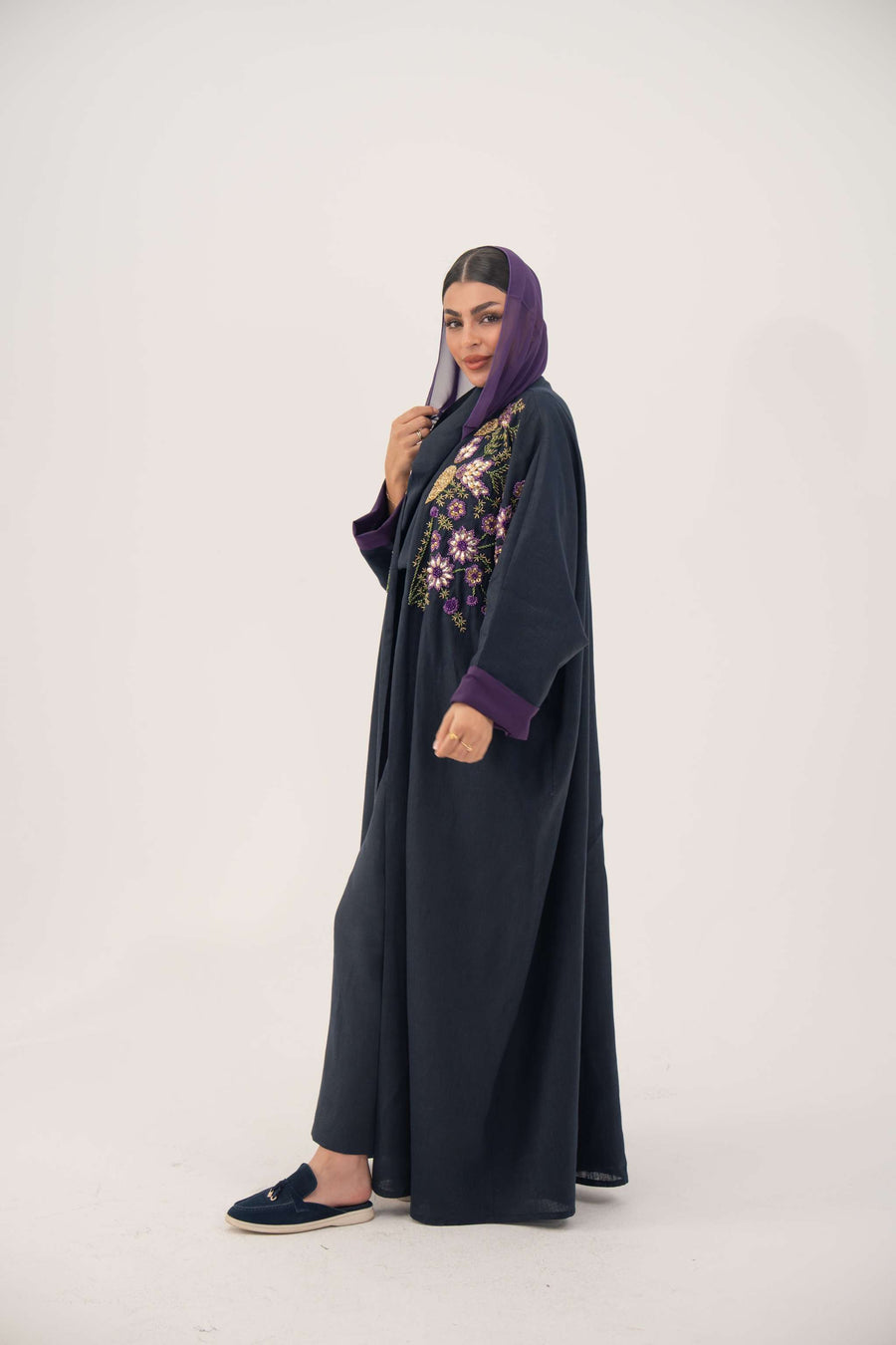navy blue linen-blend abaya with hand-stitched floral details and purple cuffs