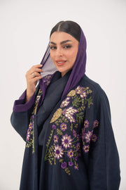 Navy blue linen-blend abaya with purple cuffs, floral hand-stitched details, and lightweight chiffon lining