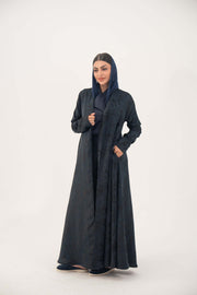 Elegant navy jacquard abaya with subtle textured pattern and soft shimmer, featuring a flowing cut for graceful drape and versatile wear.