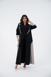 Woman wearing black and grey Shadow Blazer Crepe abaya with embroidery and relaxed blazer cut