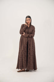 Warm cocoa brown jacquard silk abaya with subtle floral pattern and long sleeves in relaxed A-line cut