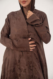 Relaxed A-line full-length cocoa brown jacquard silk abaya with subtle floral pattern and long sleeves