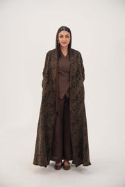 woman wearing lightweight espresso brown jacquard silk abaya with subtle tonal pattern and open-front design