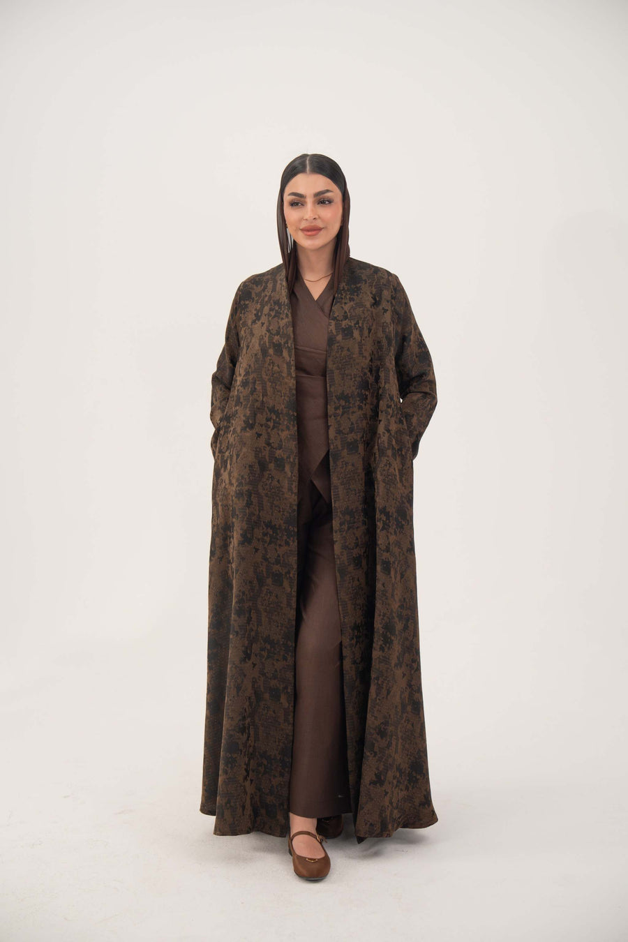 Lightweight jacquard silk espresso brown abaya with subtle textured weave, open front, side pockets, full sleeves, and floor-length design.